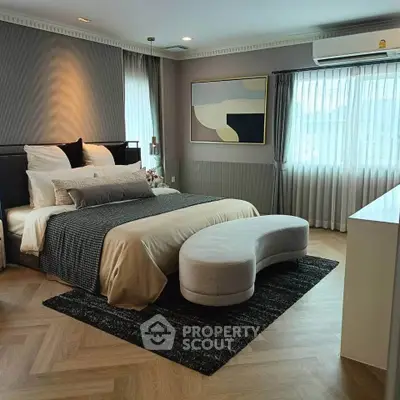 Luxurious bedroom with modern decor and natural light