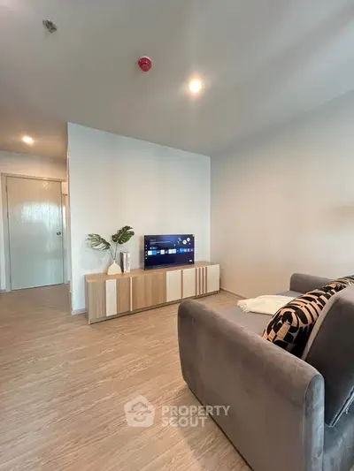 Modern living room with sleek furniture and stylish decor in a contemporary apartment.