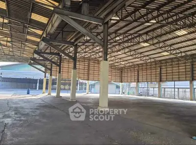 Spacious industrial warehouse with high ceilings and ample natural light