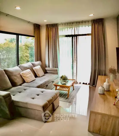 Modern living room with large windows and stylish decor