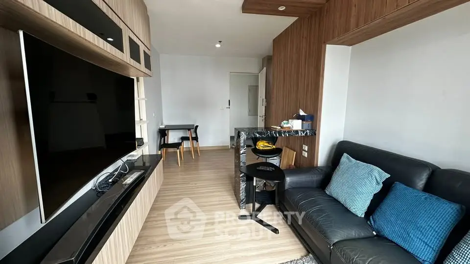 Modern living room with sleek wooden accents and cozy seating area.
