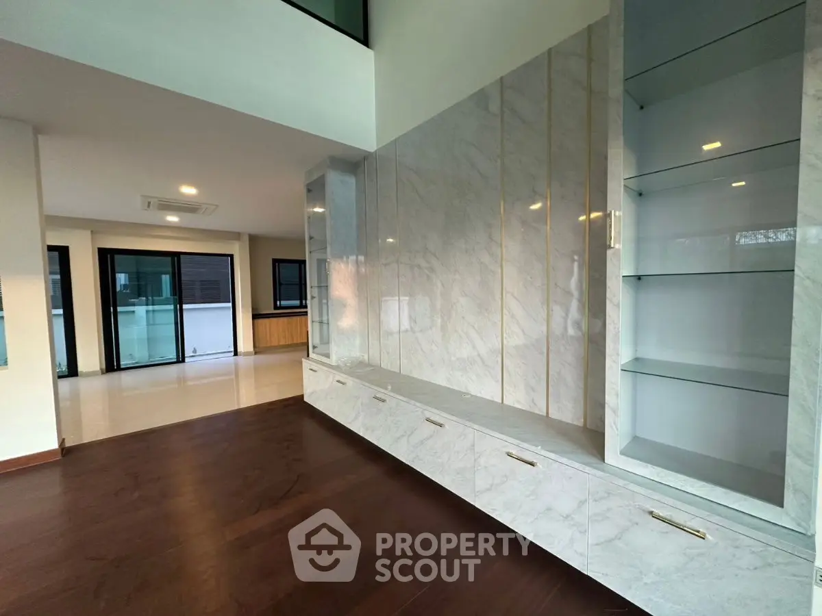 Luxurious modern living room with marble accents and spacious open layout