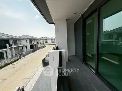 Modern balcony with sleek design overlooking residential street