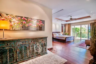 Luxurious bedroom with elegant decor and large windows opening to a scenic view.