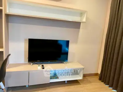 Modern living room with sleek TV unit and stylish decor