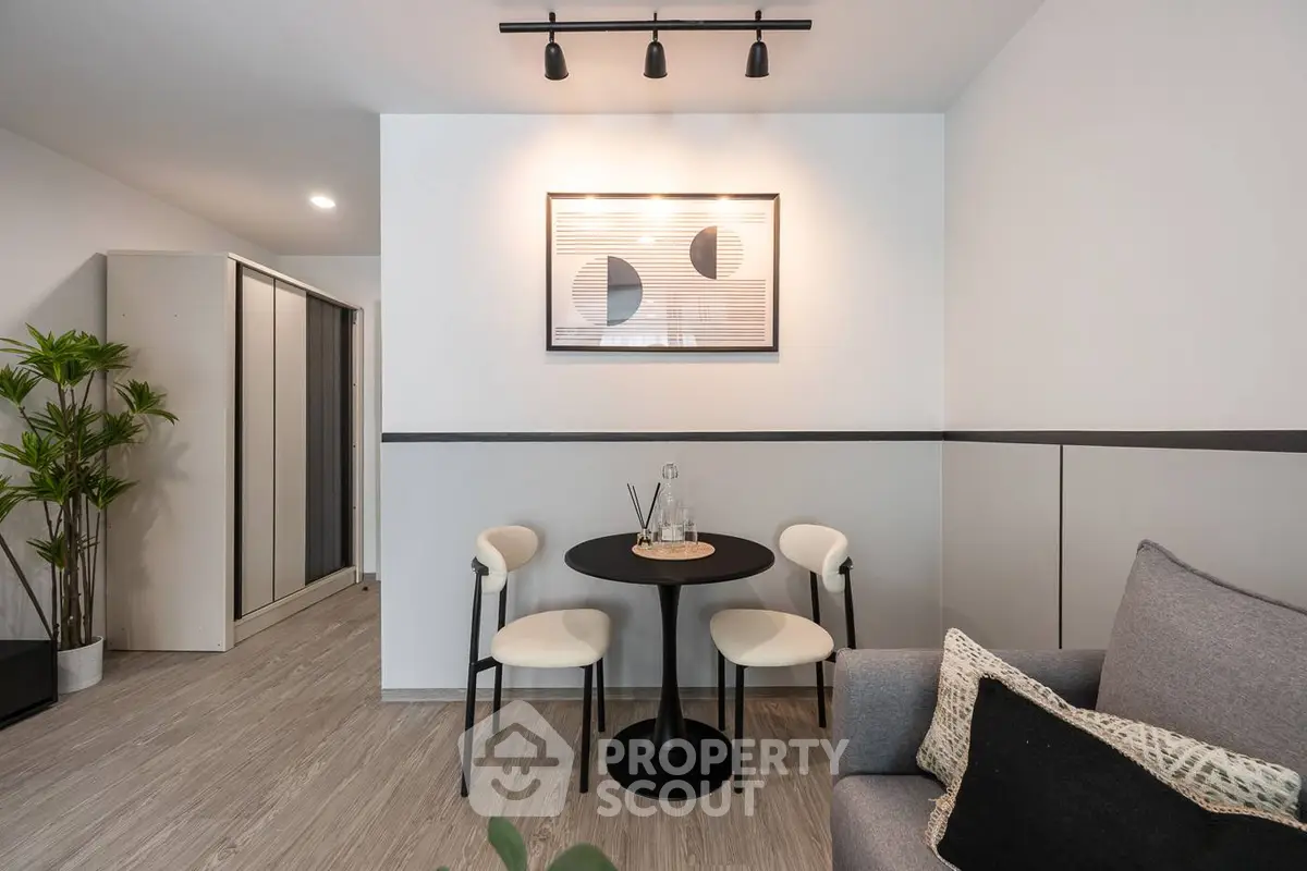 Modern living room with stylish decor and cozy seating area.