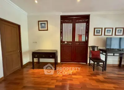 Elegant living room with wooden flooring and traditional decor