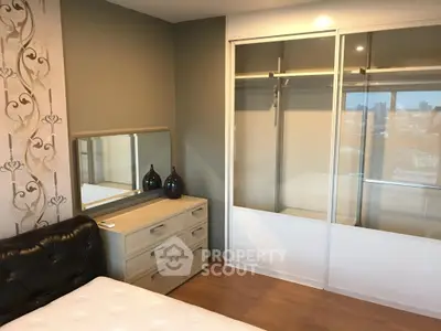 Modern bedroom with stylish decor and spacious closet in urban apartment