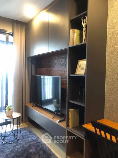 Modern living room with sleek TV unit and stylish shelving