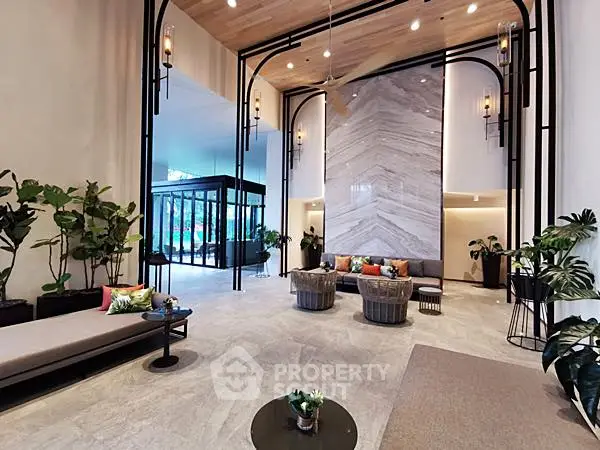 Luxurious modern lobby with high ceilings and elegant decor