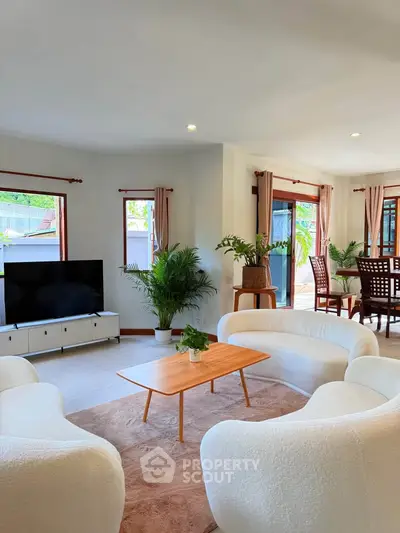 Spacious living room with modern furniture and natural light