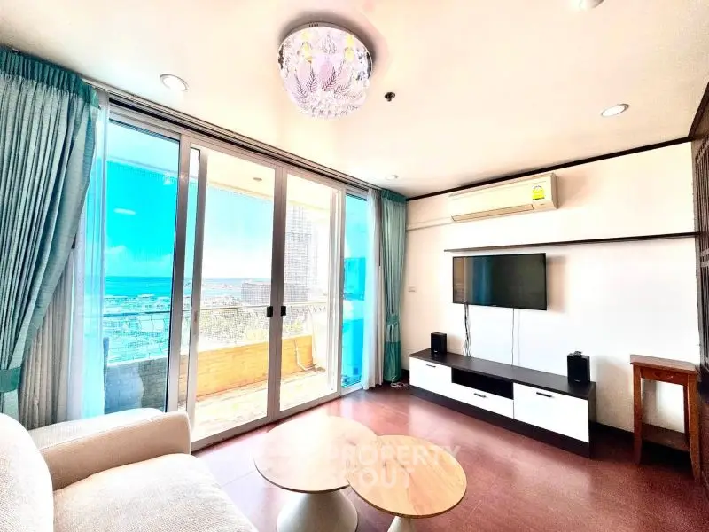 Spacious living room with ocean view and modern decor