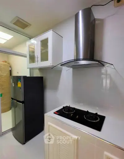 Modern kitchen with sleek gas stove and stainless steel appliances