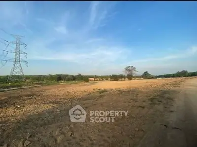 Expansive land plot with clear skies, ideal for development or investment opportunities.
