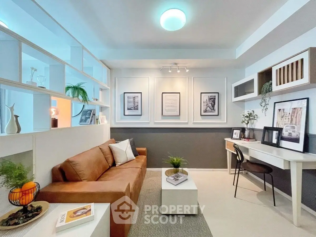 Stylish modern living room with cozy sofa, elegant decor, and functional workspace in a bright, open layout.