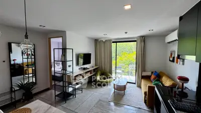 Modern living room with stylish decor and large window view