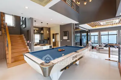 Luxurious living room with pool table and modern decor