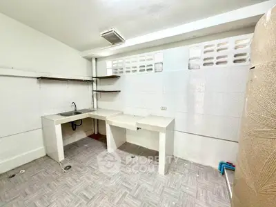 Spacious kitchen with open layout and modern fixtures, ideal for culinary enthusiasts.