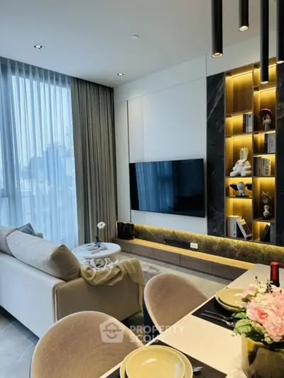 Modern living room with elegant decor and large windows in a stylish apartment.