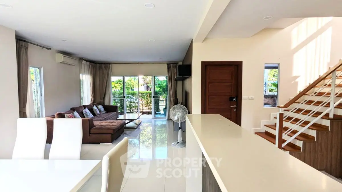 Spacious modern living room with elegant decor and natural light