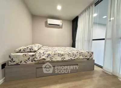 Modern bedroom with stylish bed and air conditioning in a bright apartment