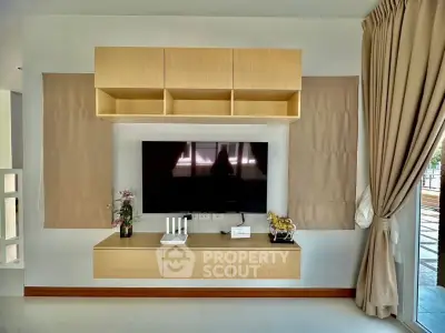 Modern living room with wall-mounted TV and stylish decor