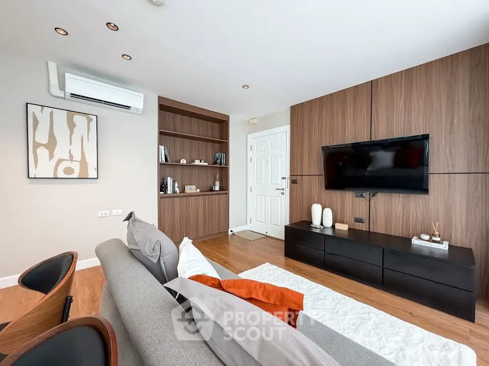 Modern living room with stylish wooden paneling and sleek furniture
