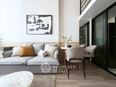 Modern living room with stylish decor and cozy seating area in a contemporary apartment.