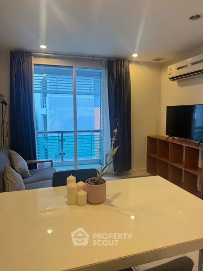 Modern living room with sleek furniture and large window view