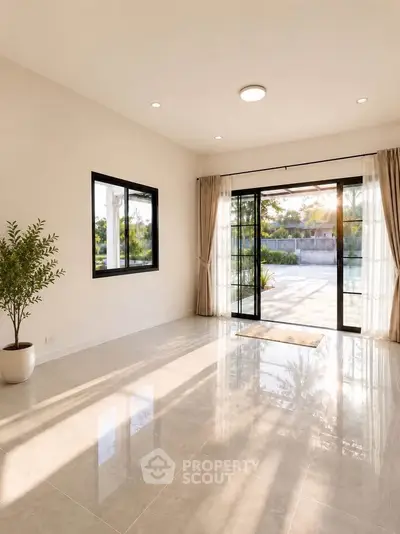 Spacious sunlit living room with large windows and garden view, perfect for modern living.