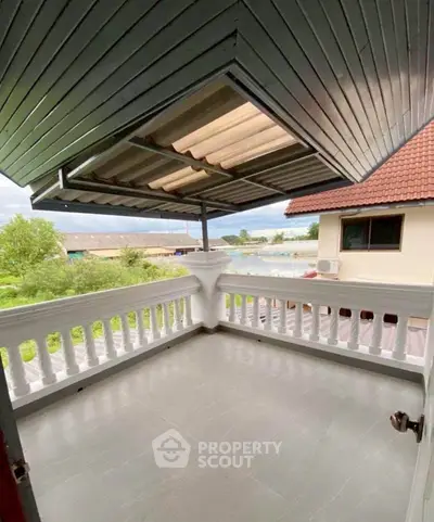 Charming balcony with scenic view and stylish roof design