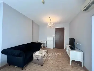 Elegant living room with chandelier and modern furniture