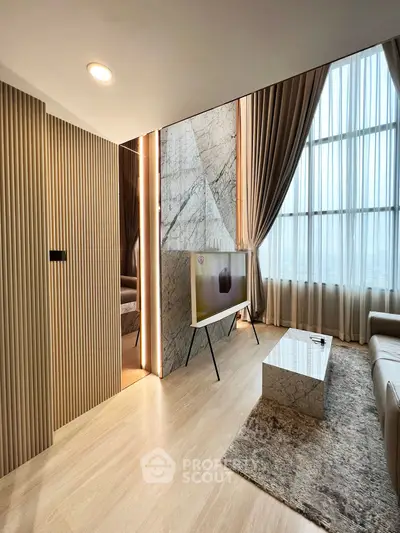 Luxurious modern living room with marble accents and floor-to-ceiling windows