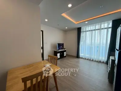Spacious modern living room with natural light and elegant decor
