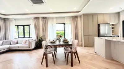 Spacious modern living room with elegant dining area and large windows