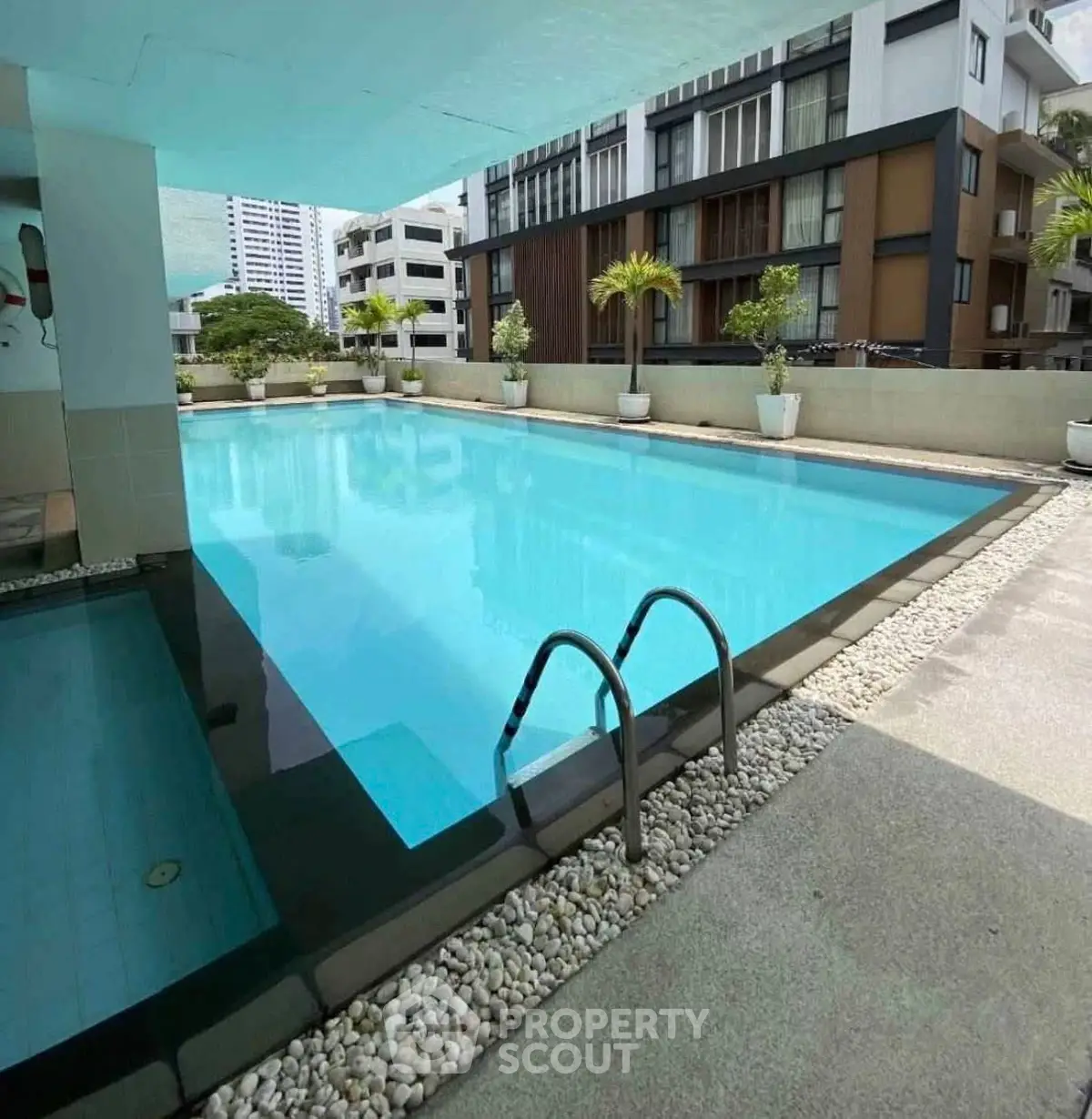 Luxurious residential pool area with modern design and serene ambiance.