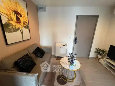 Cozy living room with modern decor and sunflower artwork, perfect for relaxation.