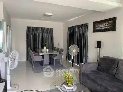 Spacious living room with elegant dining area and modern decor