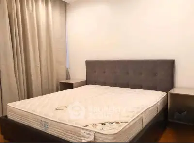 Spacious bedroom with elegant bed and modern decor