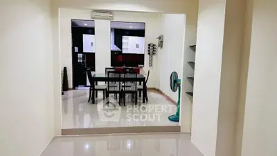 Spacious dining area with modern kitchen in open layout apartment