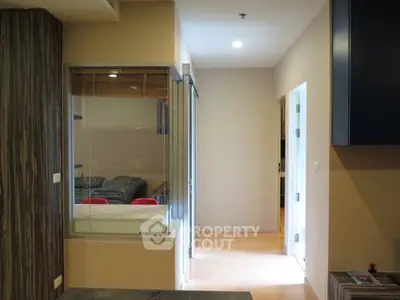 Modern apartment interior with hallway and living area view