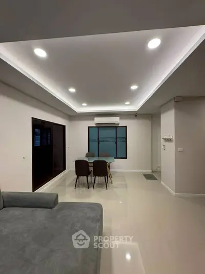 Modern living room with sleek furniture and ambient lighting, perfect for stylish urban living.