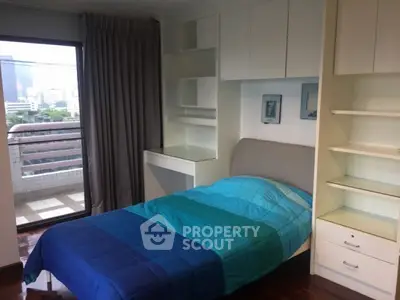 Cozy bedroom with balcony view in modern apartment