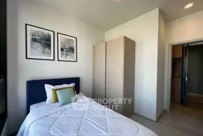 Cozy bedroom with modern decor and ample natural light