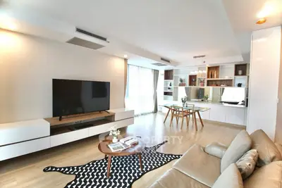 Spacious modern living room with stylish decor and open dining area