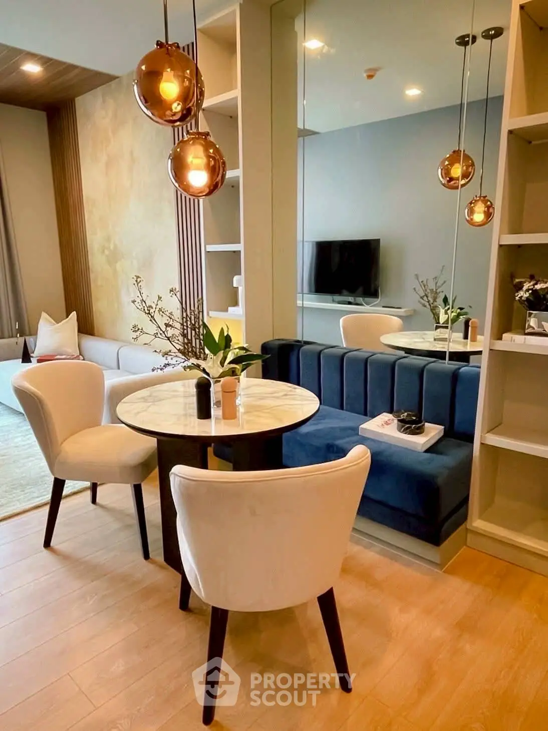 Stylish modern living room with elegant lighting and cozy seating area.