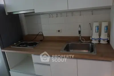 Modern kitchen with sleek cabinetry and dual water filters