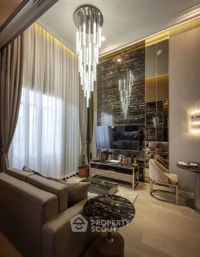Luxurious modern living room with elegant chandelier and stylish decor