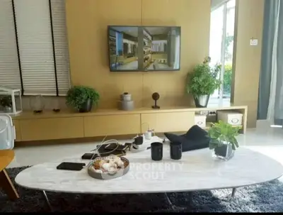 Stylish living room with modern decor and wall-mounted TV