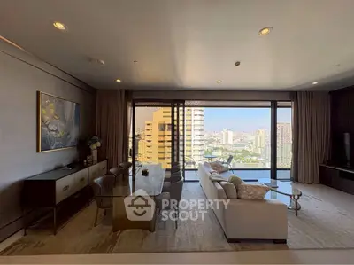 Luxurious living room with stunning city view and elegant furnishings.